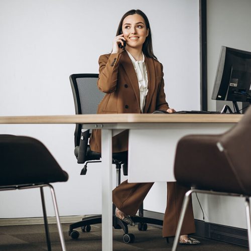 young-business-woman-working-laptop-office